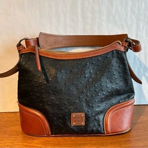 Black and brown Dooney and Bourke ostrich print hand bag with matching wallet